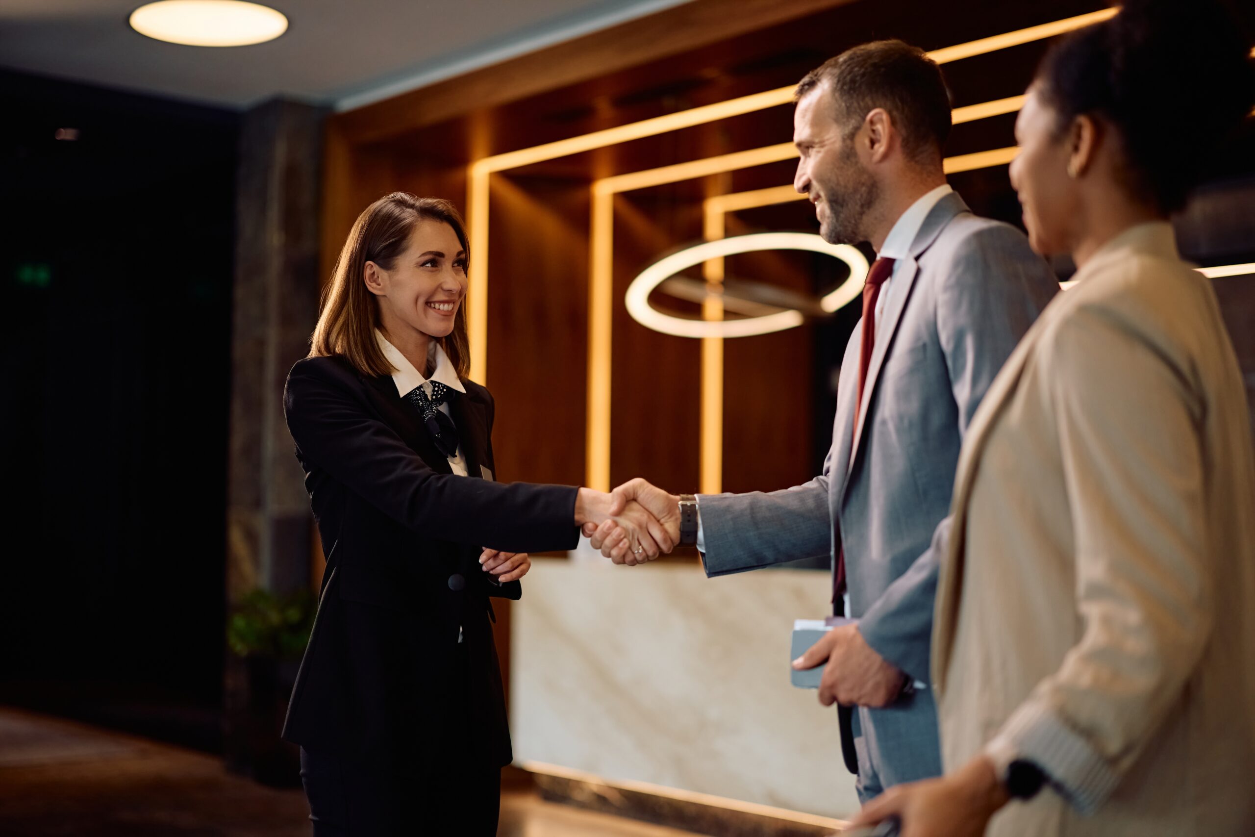A direct salesperson greeting the clients.